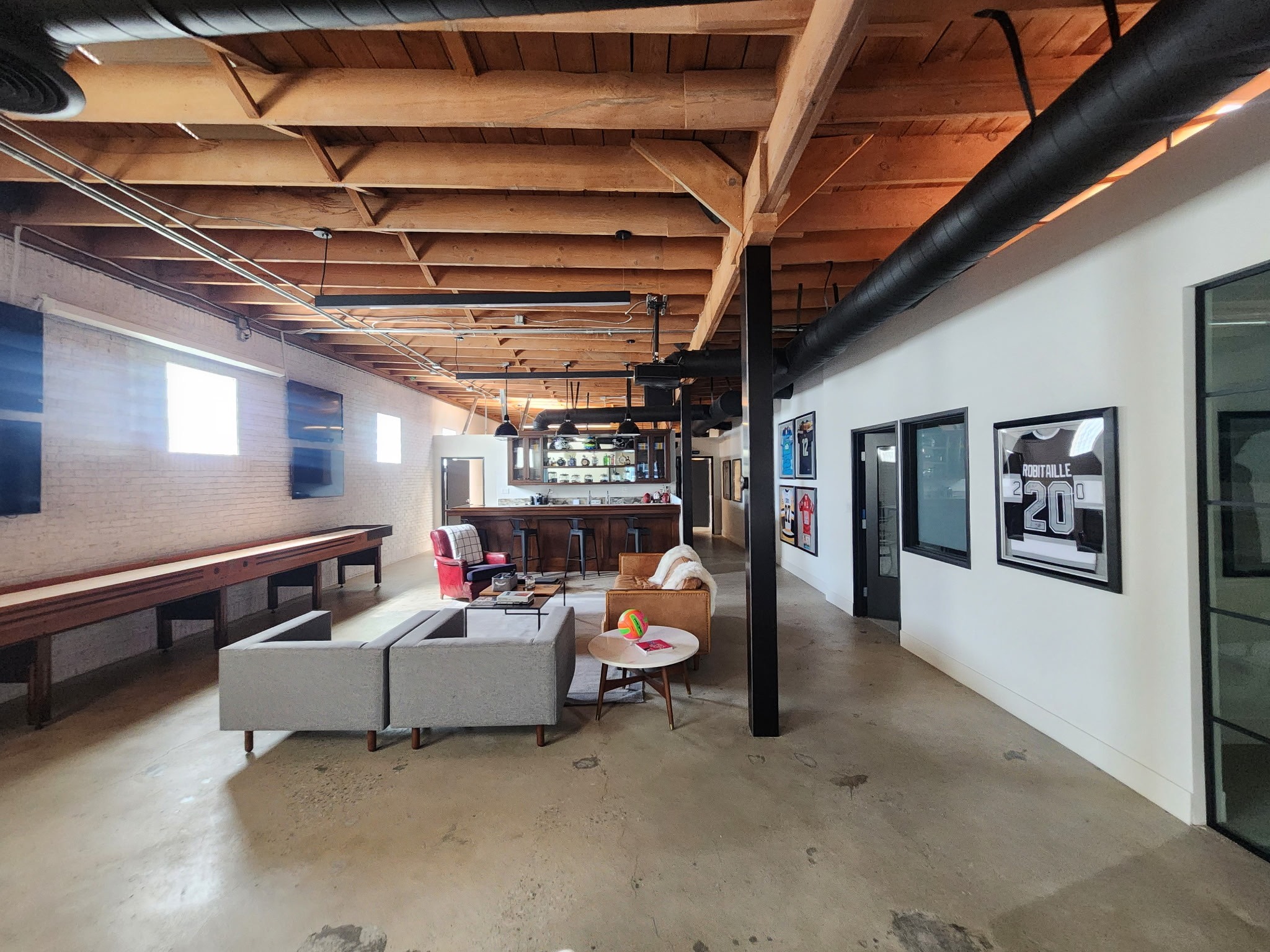 Eucalyptus Studio commercial workspace with exposed timber beams and lounge seating