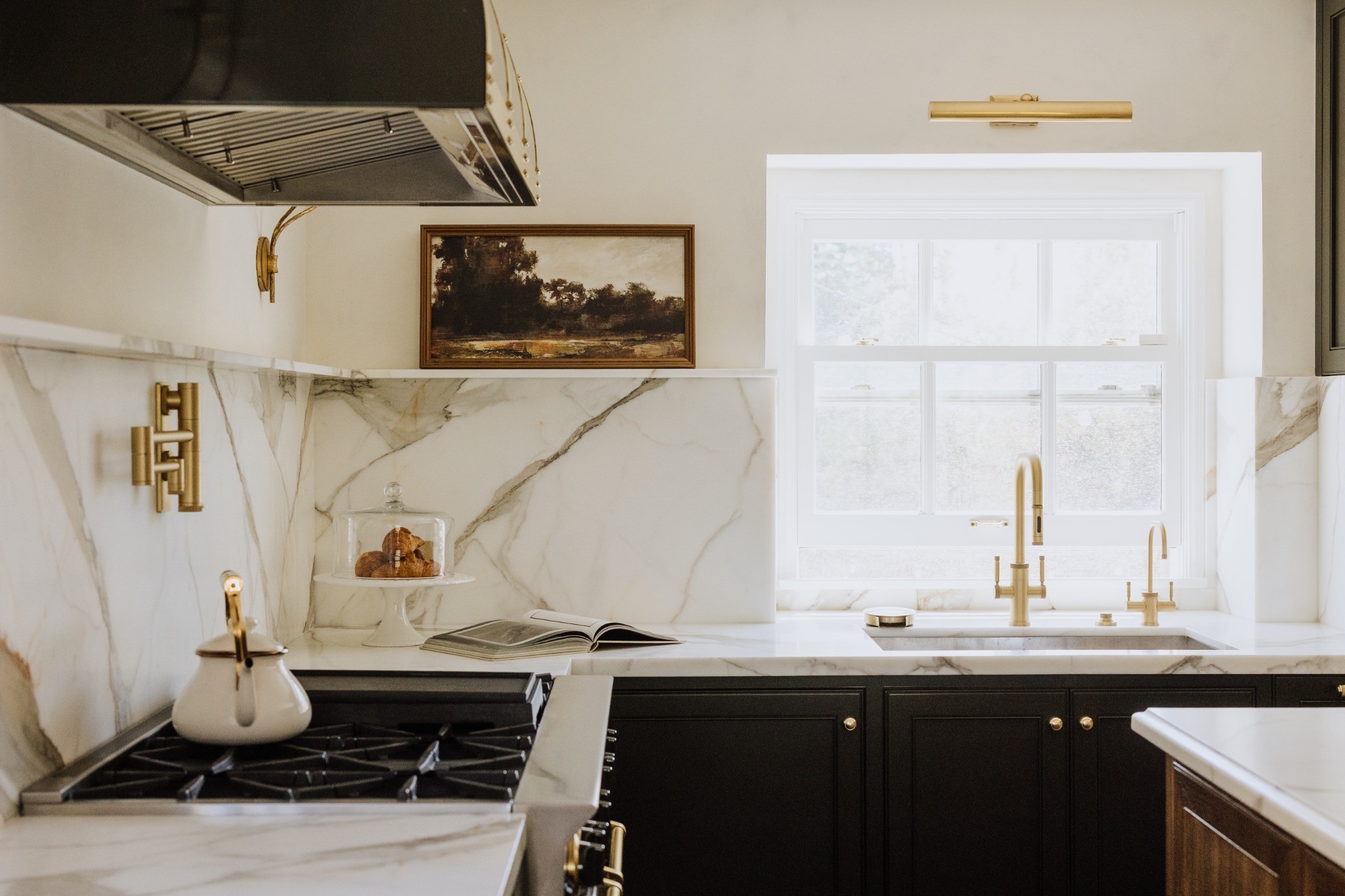 Via Cerritos custom kitchen with marble backsplash and brass details
